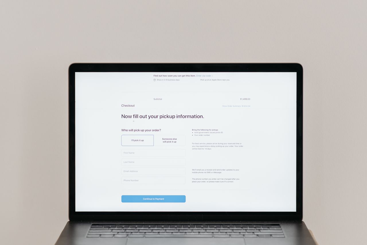 brand-01 A laptop displaying an online checkout form, highlighting technology and e-commerce.